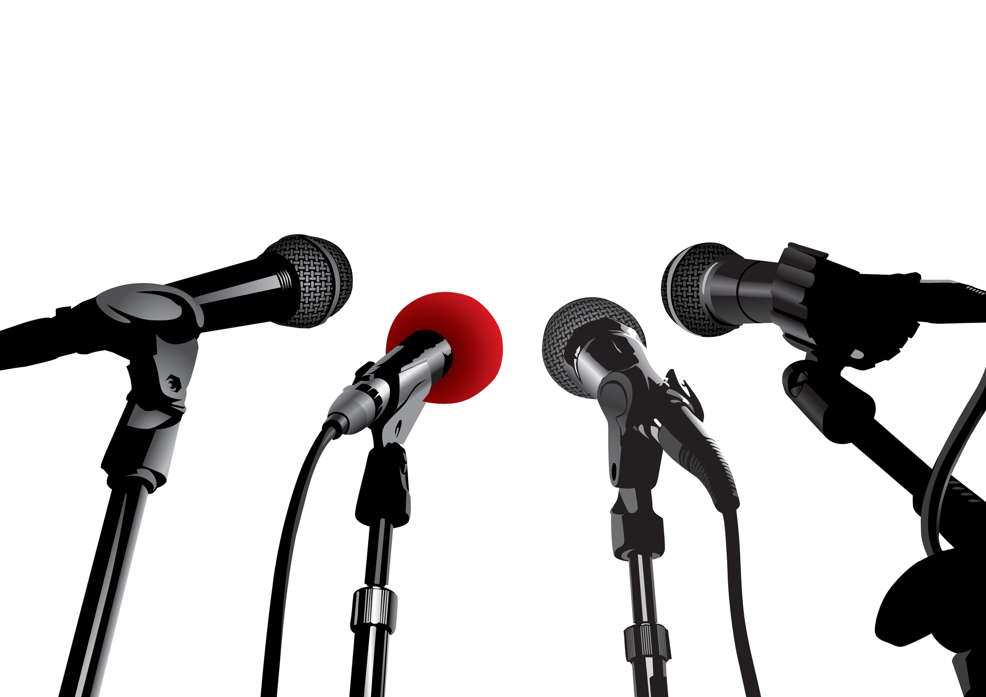 microphones Four microphones facing each other against a white background