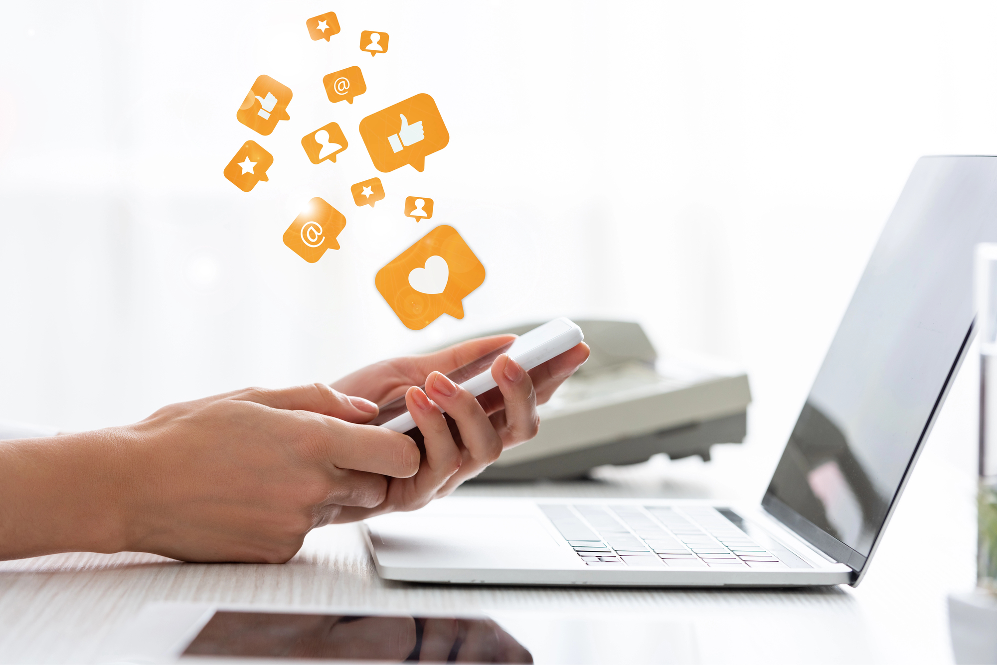 Social media on laptop and phone